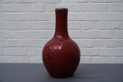 A Chinese monochrome oxblood-glazed bottle vase, 19th C.